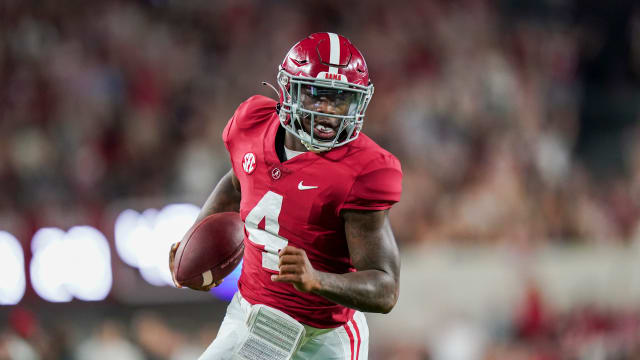 Alabama Crimson Tide quarterback Jalen Milroe (4) carries the ball against the Vanderbilt Commodores during the second half at Bryant-Denny Stadium.